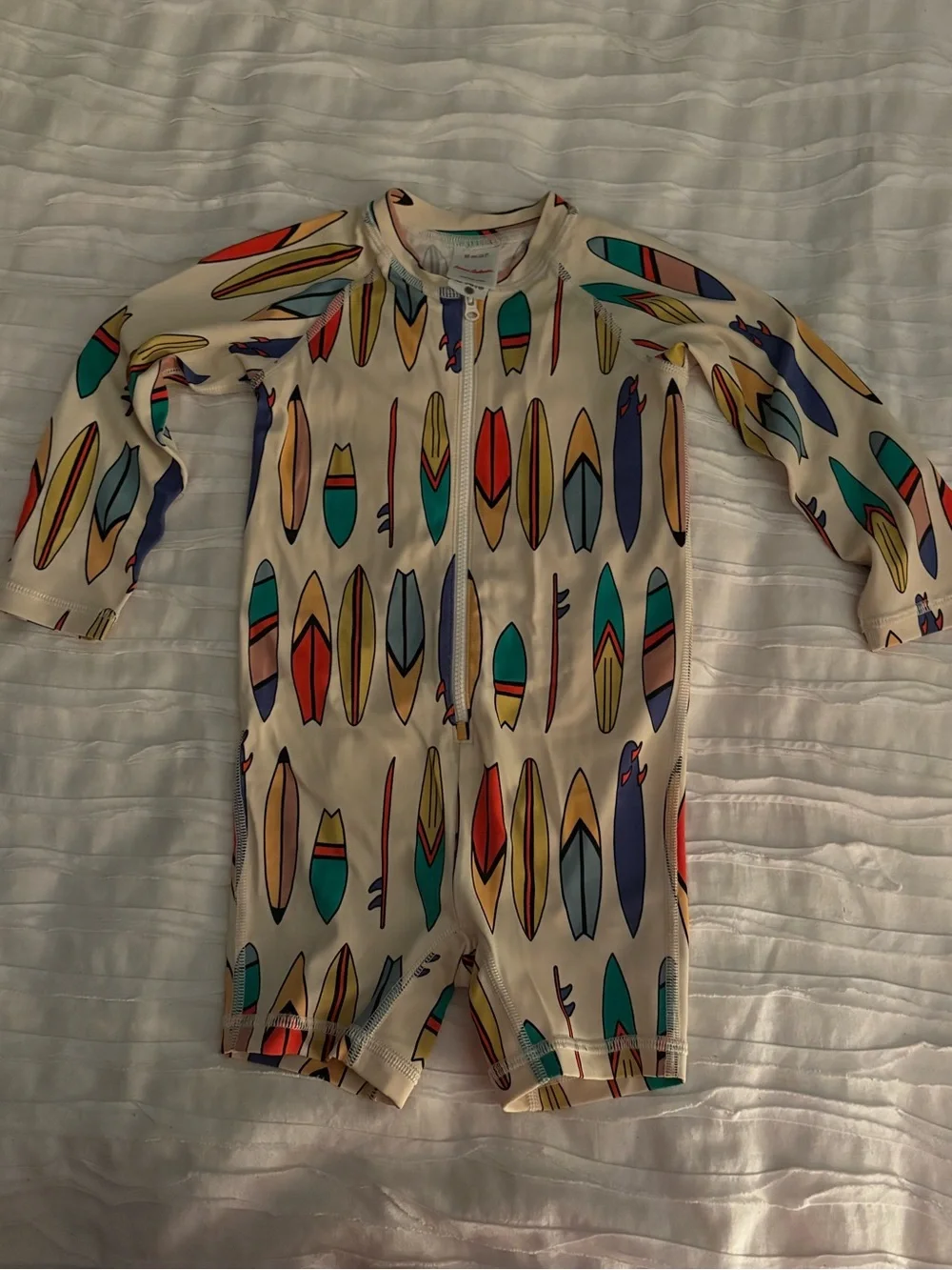 Hanna Andersson Cream Rashguard One-Piece with Colorful Surfboard Print